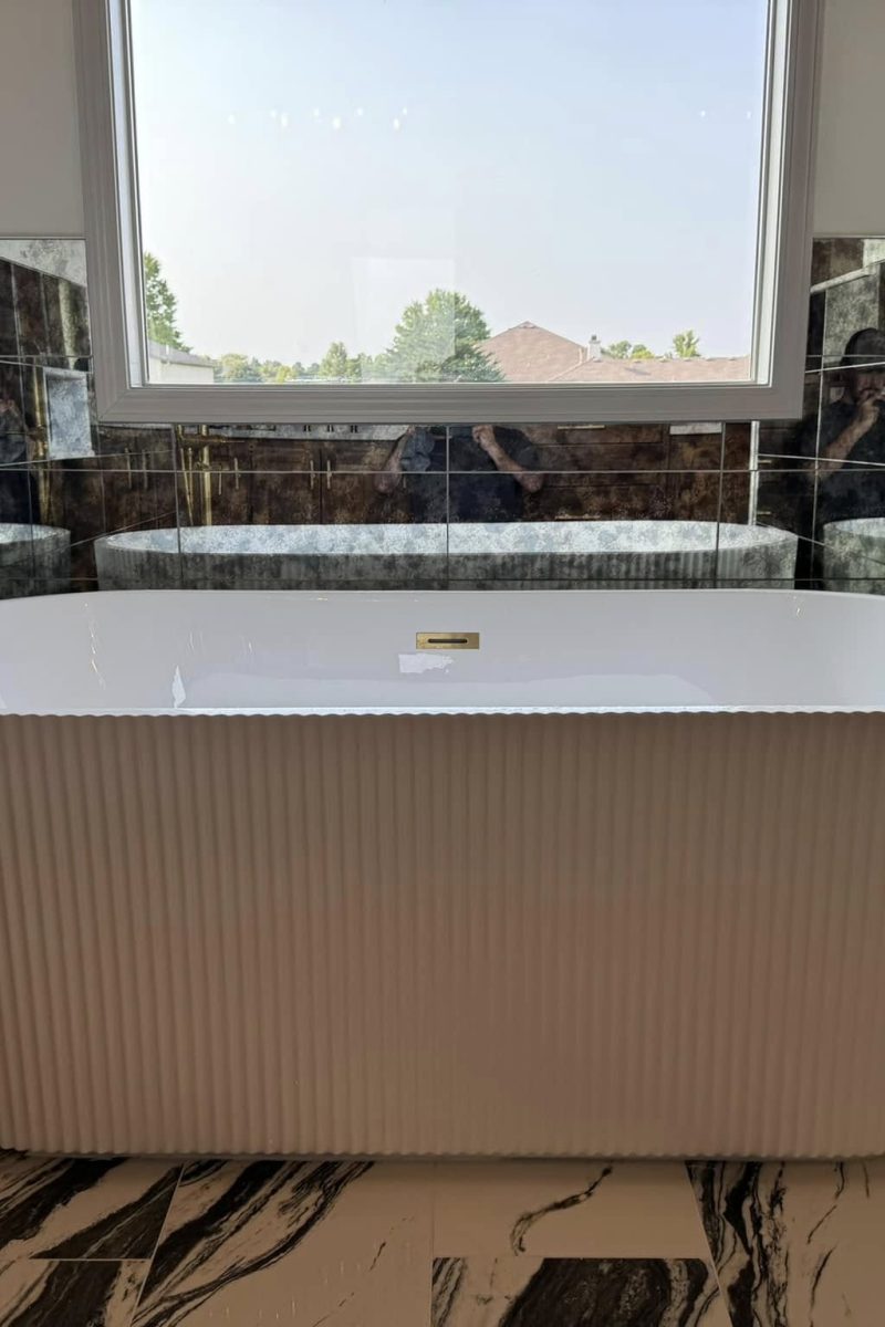 Bathroom remodel featuring modern tile work and custom shower installation by The Remodel Co in Kansas City